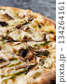 Gourmet Mushroom Cheese Pizza On Circular Wooden Board 134264161