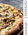 Gourmet Mushroom Cheese Pizza On Circular Wooden Board 134264162