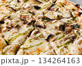 Gourmet Mushroom Cheese Pizza On Circular Wooden Board 134264163