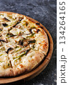 Gourmet Mushroom Cheese Pizza On Circular Wooden Board 134264165