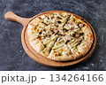 Gourmet Mushroom Cheese Pizza On Circular Wooden Board 134264166