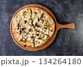 Gourmet Mushroom Cheese Pizza On Circular Wooden Board 134264180