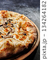 Gourmet Mushroom Cheese Pizza On Circular Wooden Board 134264182