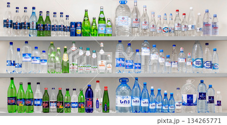 Yerevan Armenia 12.5.2025. A shelf full of water bottles with different colors and designs Yerevan Armenia 12.5.2025. A shelf full of water bottles with different colors and designs 134265771