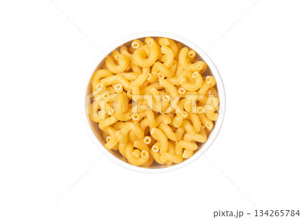 A bowl of yellow pasta with a white background A bowl of yellow pasta with a white background 134265784