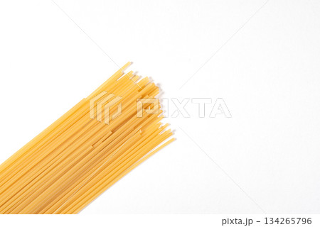 A long row of pasta is shown on a white background A long row of pasta is shown on a white background 134265796