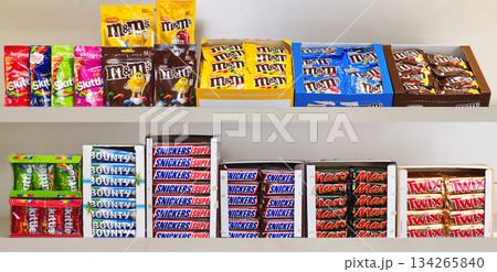 Yerevan Armenia 12.5.2025. A shelf full of candy bars including Snickers, Twix, and Milky Way Yerevan Armenia 12.5.2025. A shelf full of candy bars including Snickers, Twix, and Milky Way 134265840