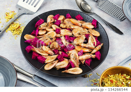 Prawns shrimps roasted with dragon fruit. 134266544