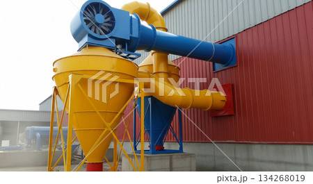A dust collection system shows a vent flap at the bottom of the cyclone unit briefly opening. Fine dust escapes, indicating air flow during collection process at a workspace. 134268019