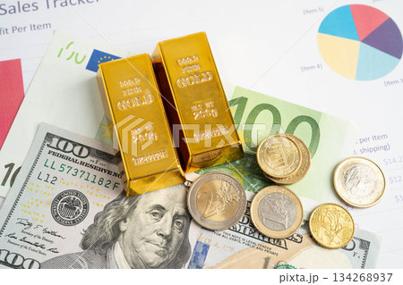 Gold bars with US dollar and Euro banknote money, finance trading investment business currency. Gold bars with US dollar and Euro banknote money, finance trading investment business currency. 134268937
