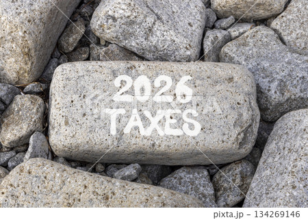 2026 taxes new year symbol. Concept words 2026 taxes on beautiful big grey stone. Beautiful grey stones background. Business and 2026 taxes new year concept. Copy space. 134269146
