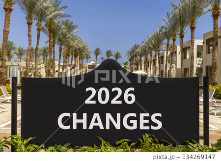 2026 Changes symbol. Concept words 2026 Changes on beautiful black road sign. Beautiful palm trees palm-trees and blue sky background. Business and 2026 changes concept. Copy space. 2026 Changes symbol. Concept words 2026 Changes on beautiful black road sign. Beautiful palm trees palm-trees and blue sky background. Business and 2026 changes concept. Copy space. 134269147