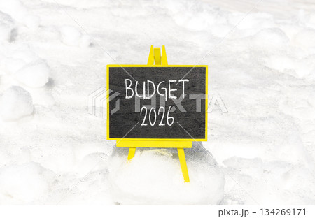 Budget 2026 symbol. Concept words Budget 2026 on beautiful black blackboard. Beautiful white snow background. Business and budget 2026 concept. Copy space. Budget 2026 symbol. Concept words Budget 2026 on beautiful black blackboard. Beautiful white snow background. Business and budget 2026 concept. Copy space. 134269171