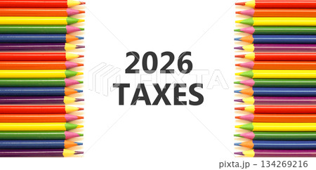 2026 taxes new year symbol. Concept words 2026 taxes on beautiful white paper. Beautiful white paper background. Beautiful colored pencils. Business and 2026 taxes new year concept. Copy space. 134269216