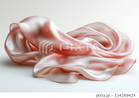 Lifestyle branding. Elegant silk scarf in natural tones with soft, flowing folds, highlighting its luxurious texture against a white background. Fashion and accessories marketing. 134269424