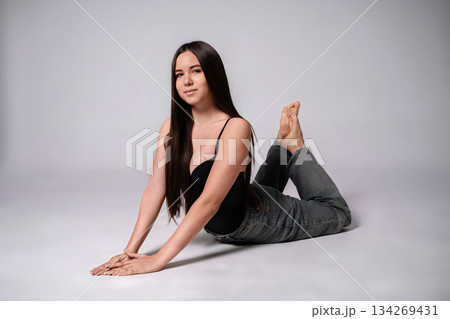 Woman yoga stretching fitness workout backbend pose flexibility healthy lifestyle studio portrait Woman yoga stretching fitness workout backbend pose flexibility healthy lifestyle studio portrait 134269431