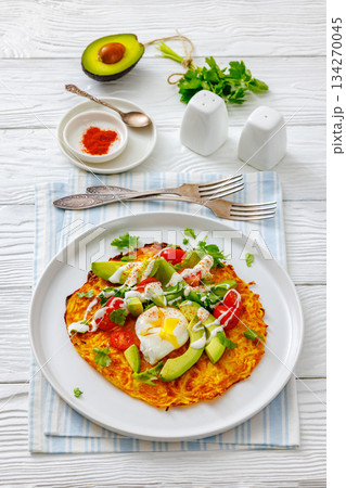 potato rosti topped with poached egg, avocado potato rosti topped with poached egg, avocado 134270045