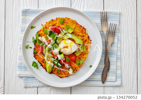 potato rosti topped with poached egg, avocado potato rosti topped with poached egg, avocado 134270052