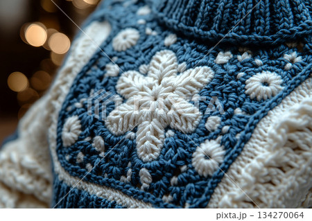 Vintage Vibes. Trending in fashion. Crochet details of snowflakes pattern on a modern garment. Winter atmosphere in clothes. Vintage Vibes. Trending in fashion. Crochet details of snowflakes pattern on a modern garment. Winter atmosphere in clothes. 134270064