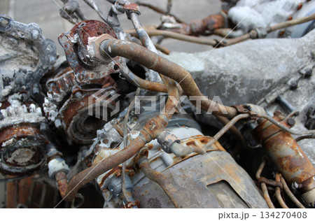 A rusty engine that has failed with corroded pipes and fuel lines. Scrapping old car parts and units stock photo  134270408