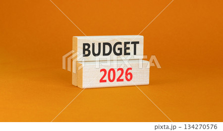 Budget 2026 symbol. Concept words Budget 2026 on beautiful wooden blocks. Beautiful orange paper background. Business and budget 2026 concept. Copy space. Budget 2026 symbol. Concept words Budget 2026 on beautiful wooden blocks. Beautiful orange paper background. Business and budget 2026 concept. Copy space. 134270576