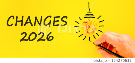 Changes 2026 symbol. Concept words Changes 2026 on beautiful yellow paper. Beautiful orange paper background. Light bulb icon. Businessman's hand with pen. Business changes 2026 concept. Copy space Changes 2026 symbol. Concept words Changes 2026 on beautiful yellow paper. Beautiful orange paper background. Light bulb icon. Businessman's hand with pen. Business changes 2026 concept. Copy space 134270632