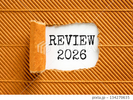 Review 2026 symbol. Concept words Review 2026 on beautiful white paper. Beautiful brown paper background. Business and review 2026 concept. Copy space. Review 2026 symbol. Concept words Review 2026 on beautiful white paper. Beautiful brown paper background. Business and review 2026 concept. Copy space. 134270635