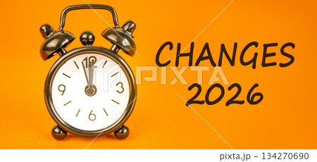Changes 2026 symbol. Concept words Changes 2026 on beautiful orange paper. Beautiful orange paper background. Beautiful black alarm clock. Business and changes 2026 concept. Copy space. 134270690