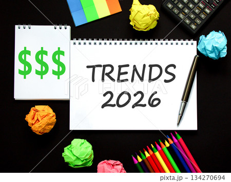 Trends 2026 new year symbol. Concept words Trends 2026 on beautiful white note. Beautiful black paper background. Beautiful black pen, calculator. Business Trends 2026 new year concept. Copy space. 134270694