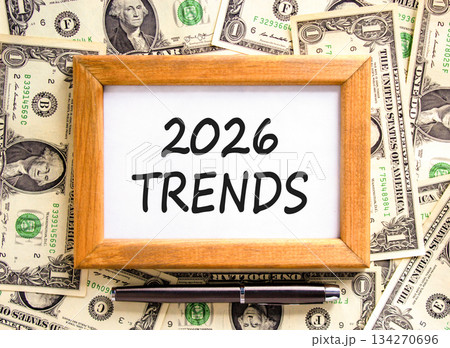 2026 Trends new year symbol. Concept words 2026 Trends on beautiful wooden picture frame. Beautiful dollar bills background. Black pen. Dollar bills. Business 2026 Trends new year concept. Copy space. 2026 Trends new year symbol. Concept words 2026 Trends on beautiful wooden picture frame. Beautiful dollar bills background. Black pen. Dollar bills. Business 2026 Trends new year concept. Copy space. 134270696