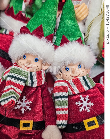 Close-Up of Christmas Elf Dolls with Scarves and Snowflakes Close-Up of Christmas Elf Dolls with Scarves and Snowflakes 134271049