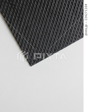 Part Of Black Perforated Panel On White Surface  134271104