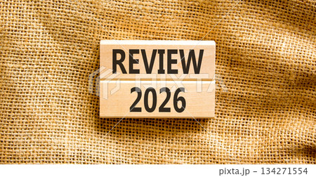 Review 2026 symbol. Concept words Review 2026 on beautiful wooden blocks. Beautiful canvas background. Business and review 2026 concept. Copy space. 134271554