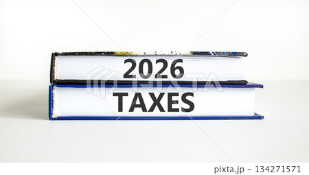 2026 taxes new year symbol. Concept words 2026 taxes on beautiful books. Beautiful white paper background. Business and 2026 taxes new year concept. Copy space. 2026 taxes new year symbol. Concept words 2026 taxes on beautiful books. Beautiful white paper background. Business and 2026 taxes new year concept. Copy space. 134271571