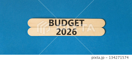 Budget 2026 symbol. Concept words Budget 2026 on beautiful wooden sticks. Beautiful blue paper background. Business and budget 2026 concept. Copy space. 134271574