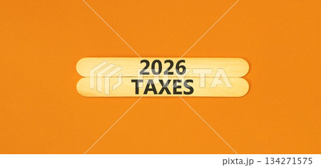 2026 taxes new year symbol. Concept words 2026 taxes on beautiful wooden sticks. Beautiful orange paper background. Business and 2026 taxes new year concept. Copy space. 134271575