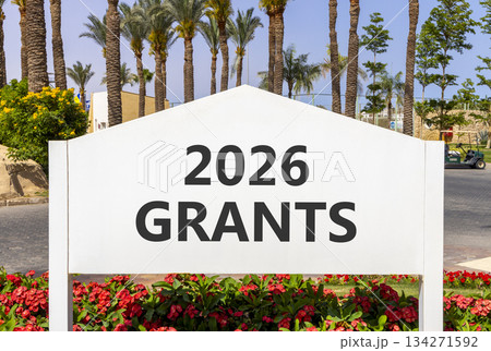 2026 Grants symbol. Concept words 2026 Grants on beautiful white road sign. Beautiful palm trees palm-trees and blue sky background. Business and 2026 grants concept. Copy space. 134271592