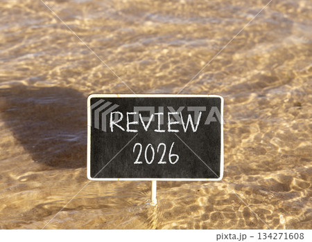 Review 2026 symbol. Concept words Review 2026 on beautiful black blackboard. Beautiful Red sea water background. Business and review 2026 concept. Copy space. Review 2026 symbol. Concept words Review 2026 on beautiful black blackboard. Beautiful Red sea water background. Business and review 2026 concept. Copy space. 134271608