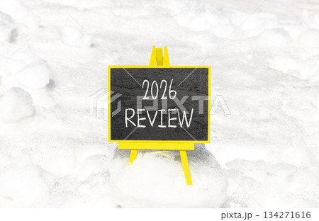 2026 Review symbol. Concept words 2026 Review on beautiful black blackboard. Beautiful white snow background. Business and 2026 review concept. Copy space. 2026 Review symbol. Concept words 2026 Review on beautiful black blackboard. Beautiful white snow background. Business and 2026 review concept. Copy space. 134271616