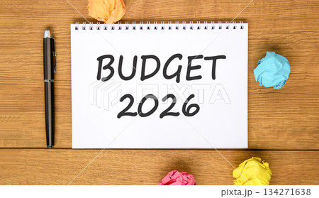 Budget 2026 symbol. Concept words Budget 2026 on beautiful white note. Beautiful wooden background. Black pen. Colored paper. Business and budget 2026 concept. Copy space. Budget 2026 symbol. Concept words Budget 2026 on beautiful white note. Beautiful wooden background. Black pen. Colored paper. Business and budget 2026 concept. Copy space. 134271638