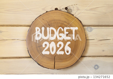 Budget 2026 symbol. Concept words Budget 2026 on beautiful wooden circle. Beautiful wooden wall background. Business and budget 2026 concept. Copy space. 134271652