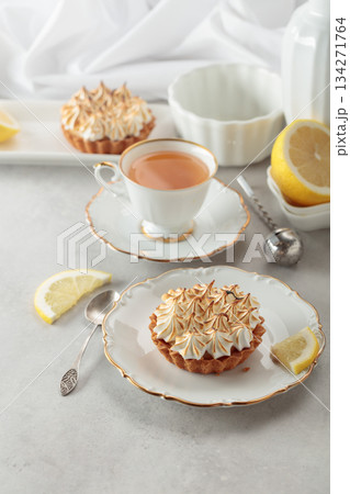 Meringue lemon tart on a white table. 134271764