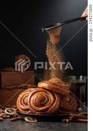 Kanelbullar. Freshly baked buns sprinkled with cinnamon. 134271800