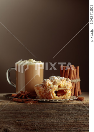 Vienna strudel and caffe latte on a silver tray. 134271805