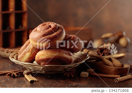 Swedish cinnamon rolls on a brown background. 134271808