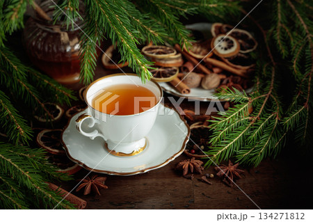 Christmas tea with spices and dried citrus slices. Christmas tea with spices and dried citrus slices. 134271812