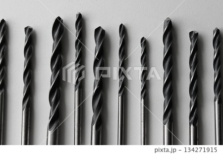 Steel Bits For Drill Driver Laid Out In Order On White. Stock Photo Of Carpenters Equipment Steel Bits For Drill Driver Laid Out In Order On White. Stock Photo Of Carpenters Equipment 134271915