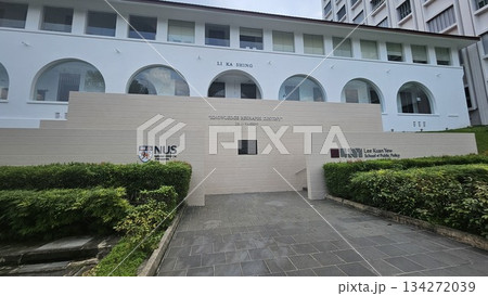 The Li Ka Shing building at NUS features arched windows and a bold quote on knowledge, reflecting academic excellence The Li Ka Shing building at NUS features arched windows and a bold quote on knowledge, reflecting academic excellence 134272039