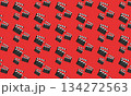 Seamless cinema pattern with movie clapperboard on red background, film production and filmmaking concept 134272563
