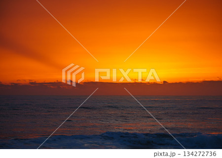 Sunrise or sunset over sea 134272736